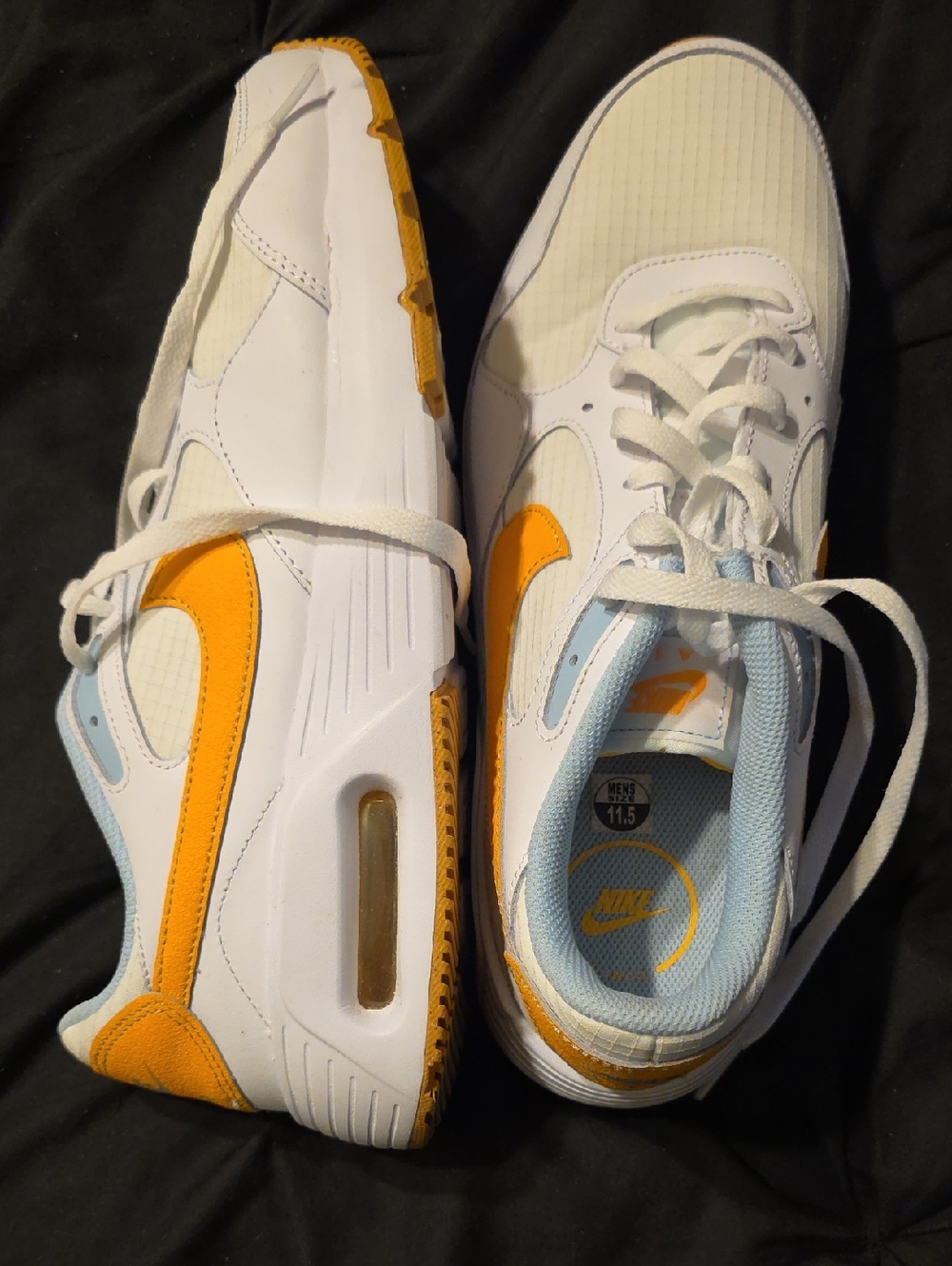 Nike White Sneakers with Orange Swoosh and Light Blue Lining